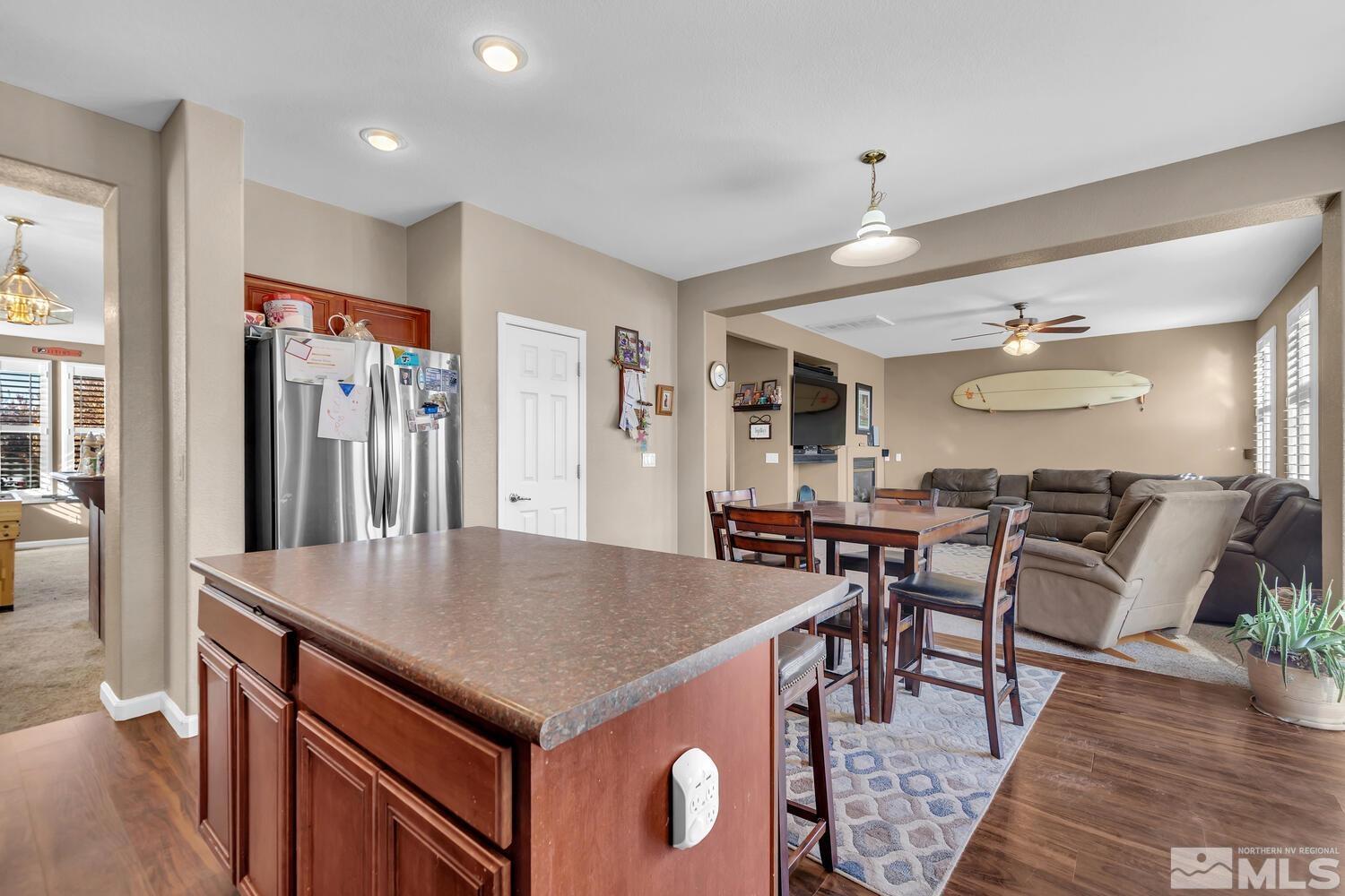 8970 Sorcha Street Reno, NV 89506 - Photo 12 of 38 a kitchen with center island table and chairs