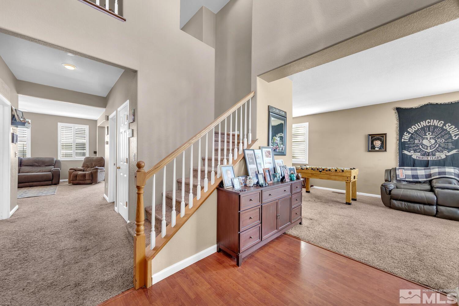 8970 Sorcha Street Reno, NV 89506 - Photo 16 of 38 a living room with furniture and stairs