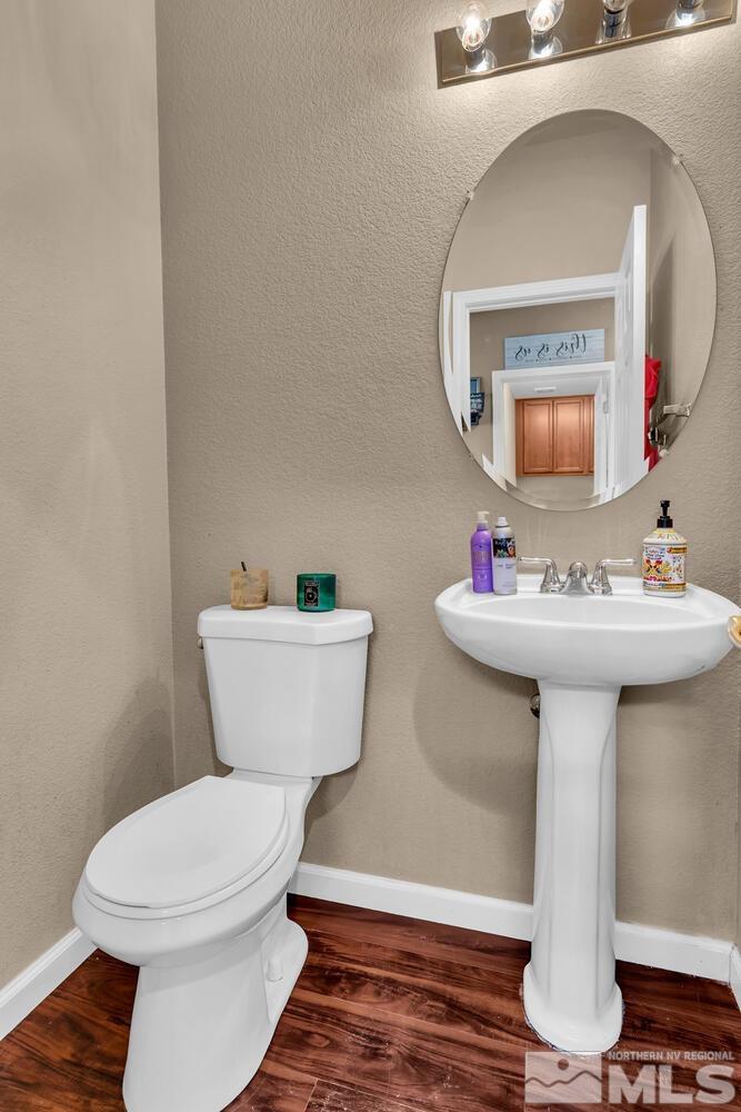 8970 Sorcha Street Reno, NV 89506 - Photo 31 of 38 a bathroom with a sink toilet and a mirror
