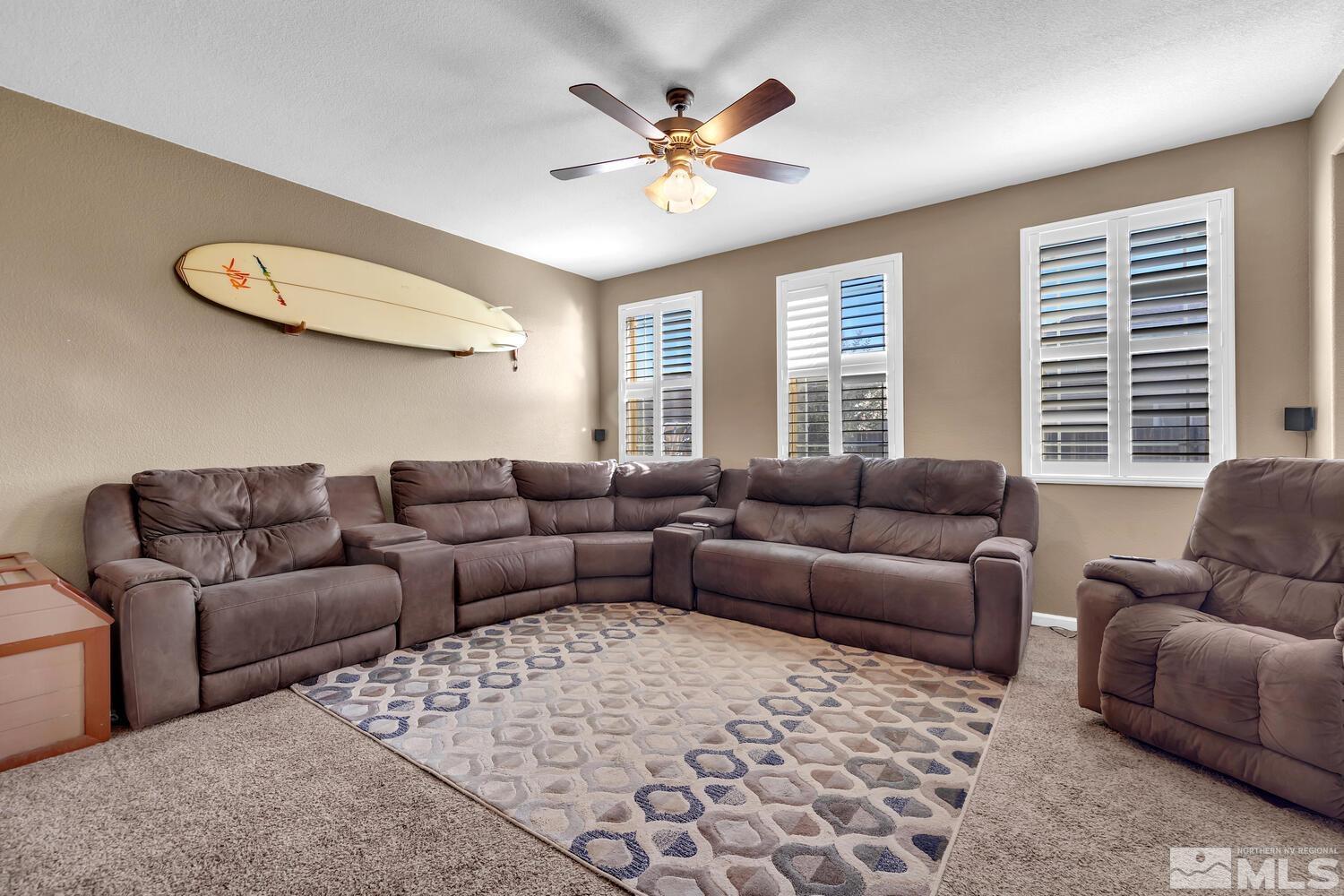 8970 Sorcha Street Reno, NV 89506 - Photo 4 of 38 a living room with furniture and a large window