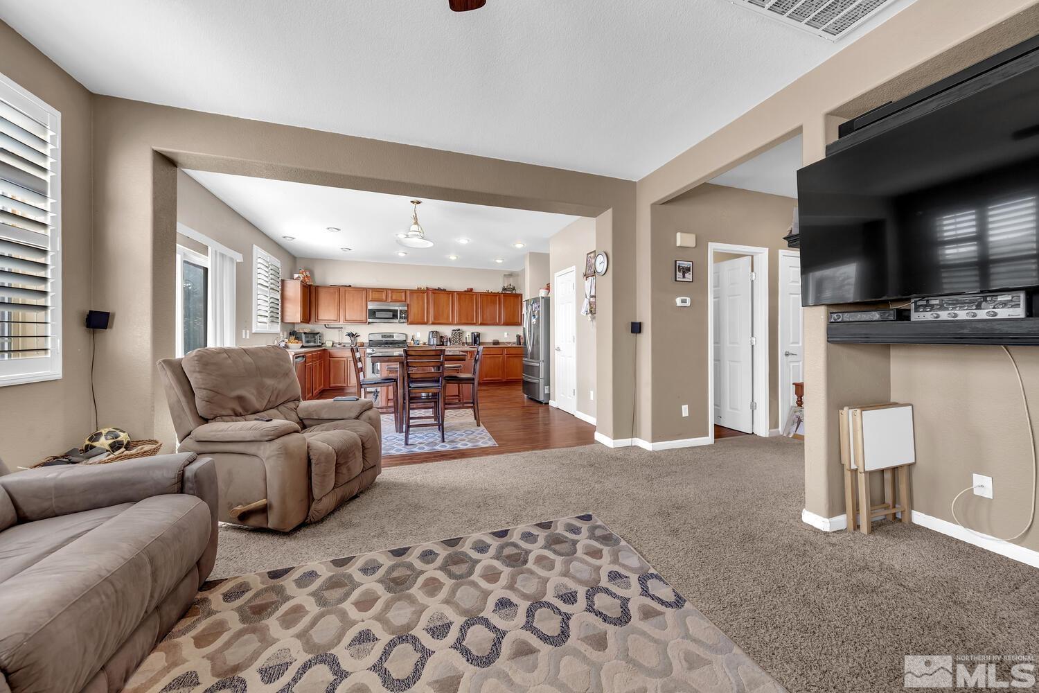 8970 Sorcha Street Reno, NV 89506 - Photo 6 of 38 a living room with furniture and a flat screen tv