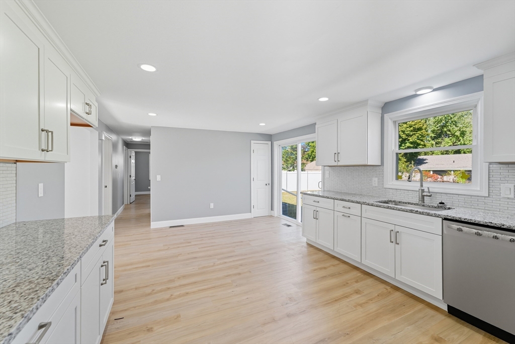 87 Prokop Avenue Ludlow, MA 01056 - Photo 14 of 40 a large kitchen with granite countertop a large counter top space appliances and cabinets