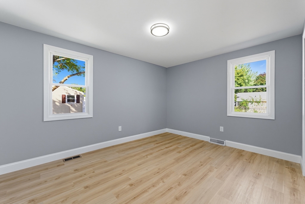 87 Prokop Avenue Ludlow, MA 01056 - Photo 24 of 40 a view of an empty room with window and wooden floor