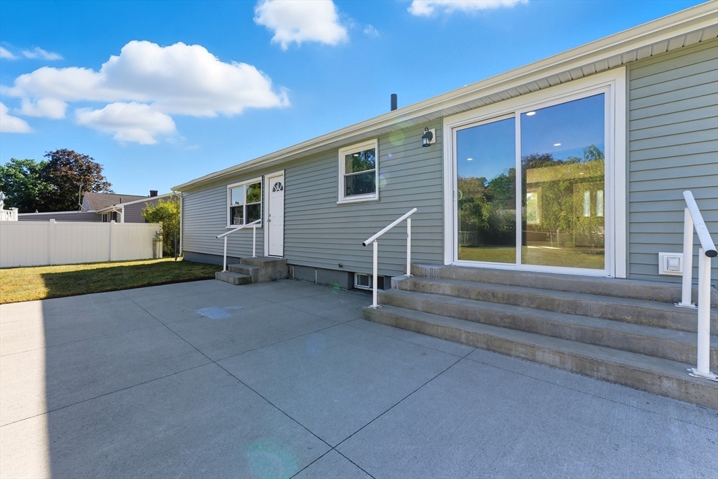 87 Prokop Avenue Ludlow, MA 01056 - Photo 35 of 40 a view of house with backyard and glass windows