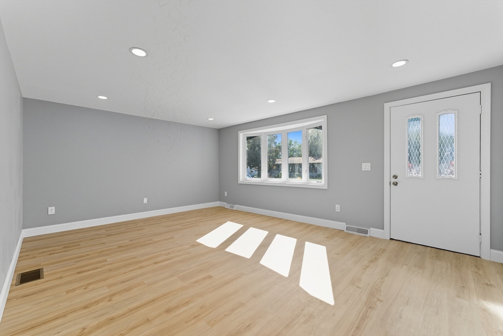 87 Prokop Avenue Ludlow, MA 01056 - Photo 4 of 40 a view of empty room with wooden floor and fan