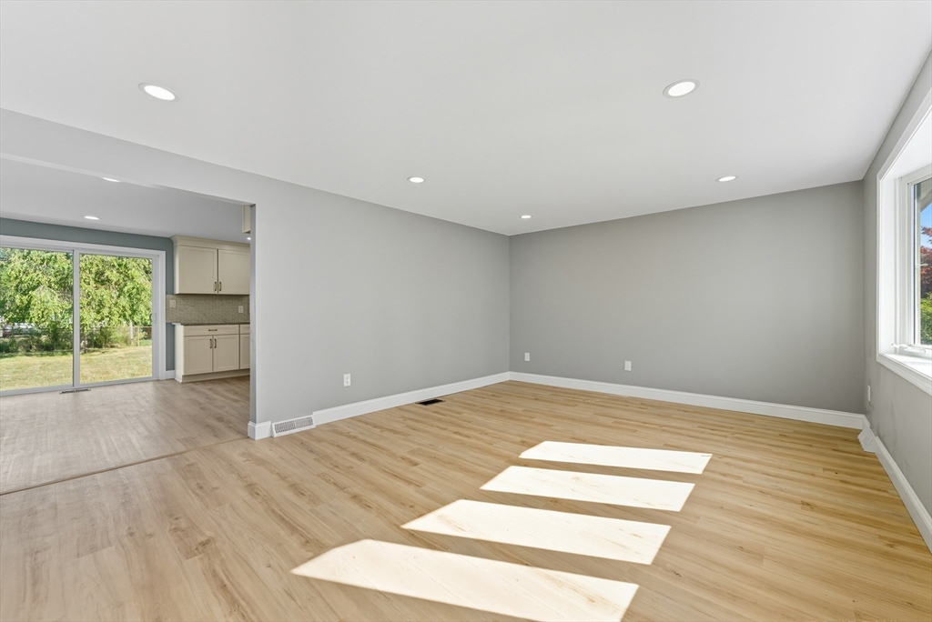 87 Prokop Avenue Ludlow, MA 01056 - Photo 5 of 40 a view of empty room with wooden floor and fan