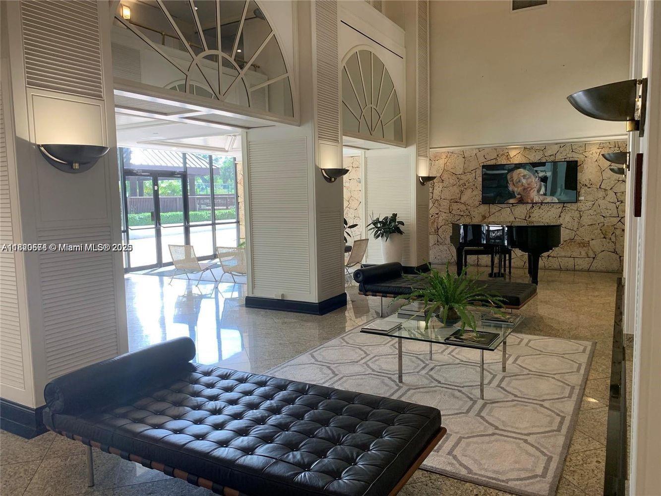 a living room with lots of furniture and a rug