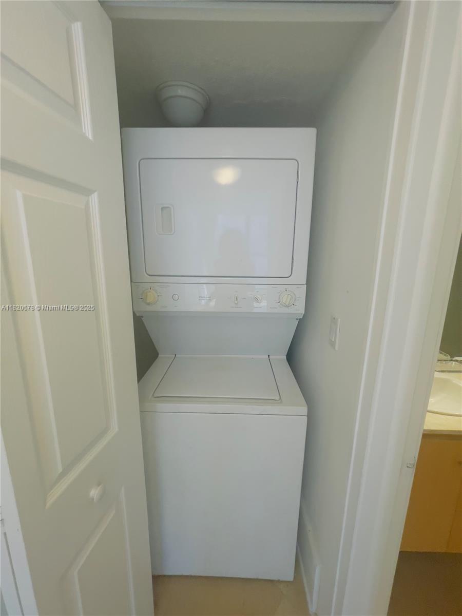 780 Northeast 69th Street, Unit 1507 Miami, FL 33138 - Photo 14 of 23 a close up view of a washer and dryer