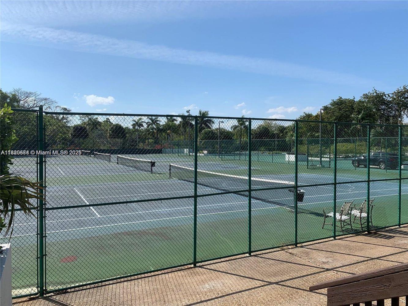 780 Northeast 69th Street, Unit 1507 Miami, FL 33138 - Photo 17 of 23 a view of a tennis court