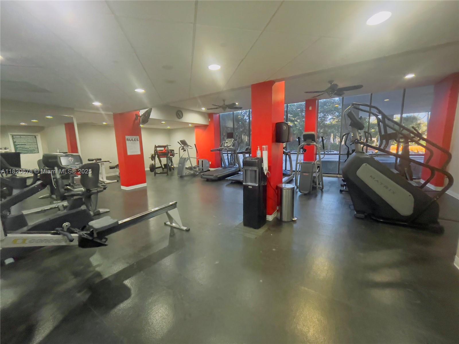 780 Northeast 69th Street, Unit 1507 Miami, FL 33138 - Photo 20 of 23 a view of a room with gym equipment