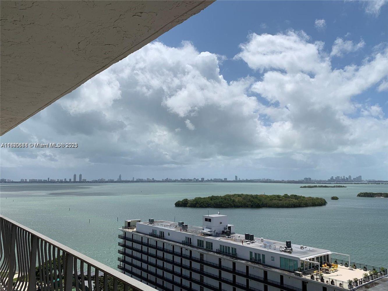 780 Northeast 69th Street, Unit 1507 Miami, FL 33138 - Photo 2 of 23 a view of lake with green landscape