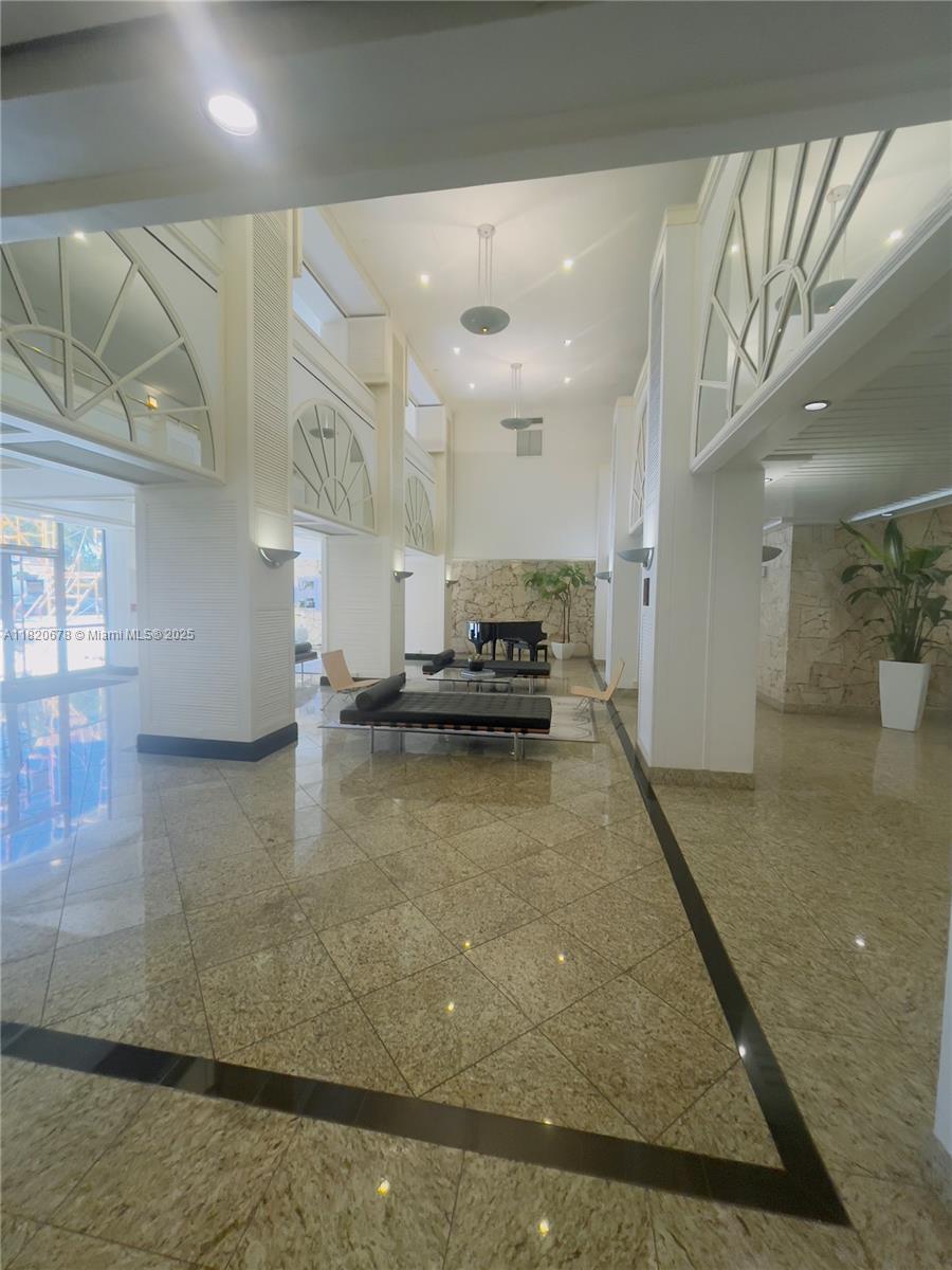 780 Northeast 69th Street, Unit 1507 Miami, FL 33138 - Photo 23 of 23 a view of a living room and kitchen