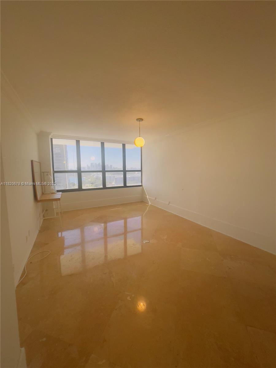 780 Northeast 69th Street, Unit 1507 Miami, FL 33138 - Photo 7 of 23 a view of empty room with a fireplace