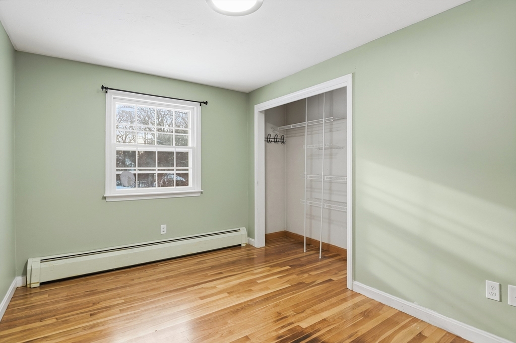 36 Hillandale Road Ashburnham, MA 01430 - Photo 13 of 31 an empty room with wooden floor and windows