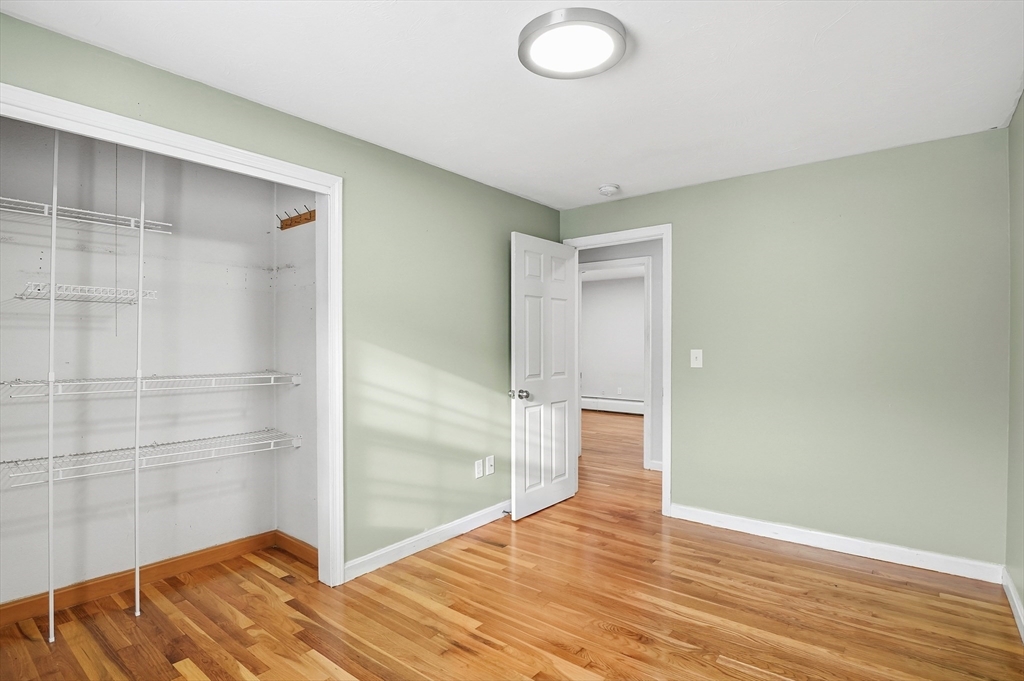 36 Hillandale Road Ashburnham, MA 01430 - Photo 14 of 31 a view of empty room with wooden floor and fan