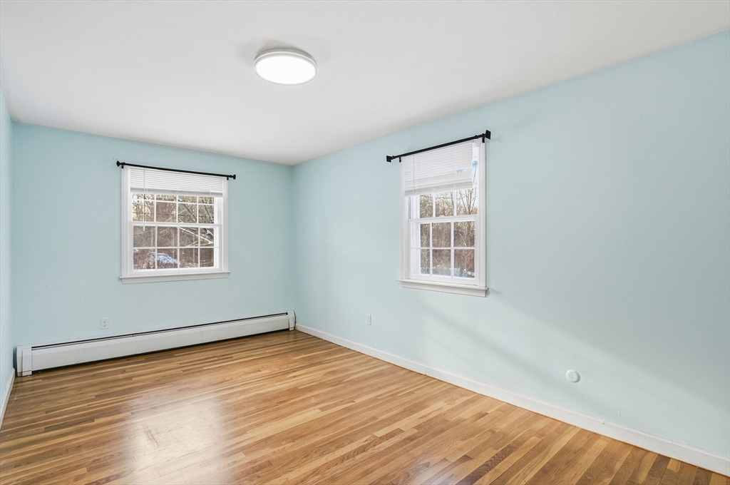 36 Hillandale Road Ashburnham, MA 01430 - Photo 15 of 31 a view of an empty room with wooden floor and a window