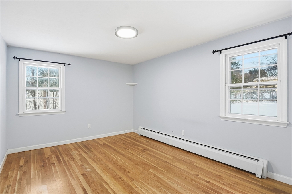 36 Hillandale Road Ashburnham, MA 01430 - Photo 17 of 31 a view of empty room with wooden floor and fan