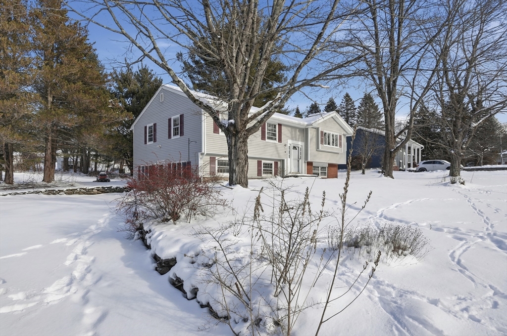 36 Hillandale Road Ashburnham, MA 01430 - Photo 2 of 31 a front view of a house with a yard covered in snow