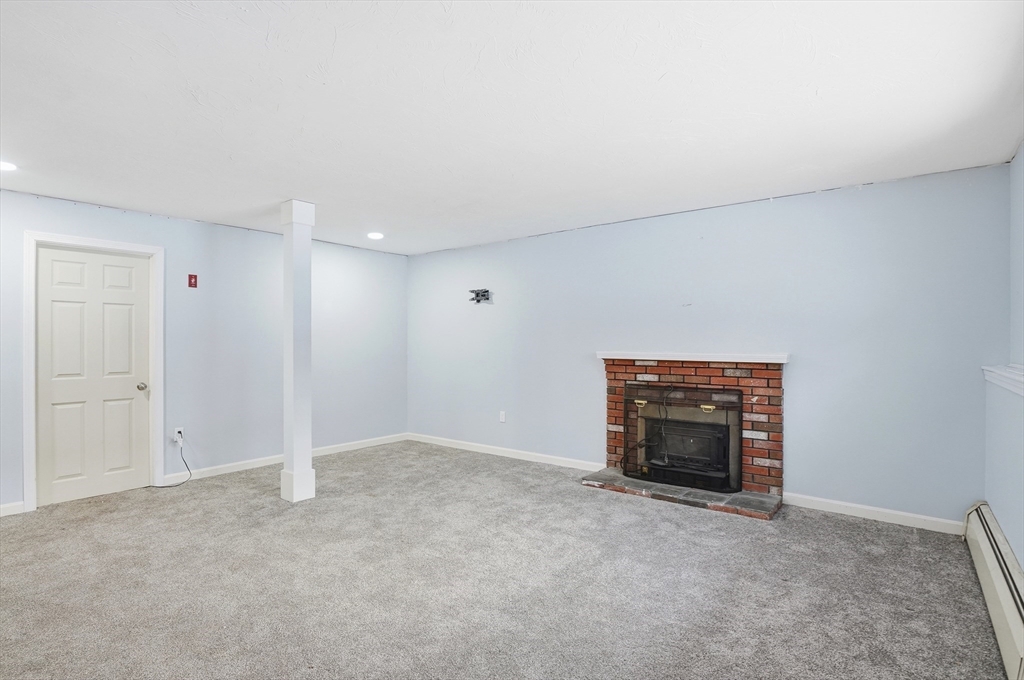 36 Hillandale Road Ashburnham, MA 01430 - Photo 21 of 31 an empty room with fireplace