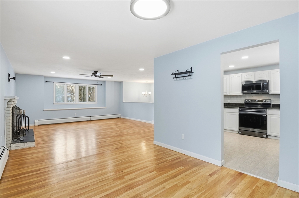 36 Hillandale Road Ashburnham, MA 01430 - Photo 6 of 31 a view of empty room with wooden floor and kitchen