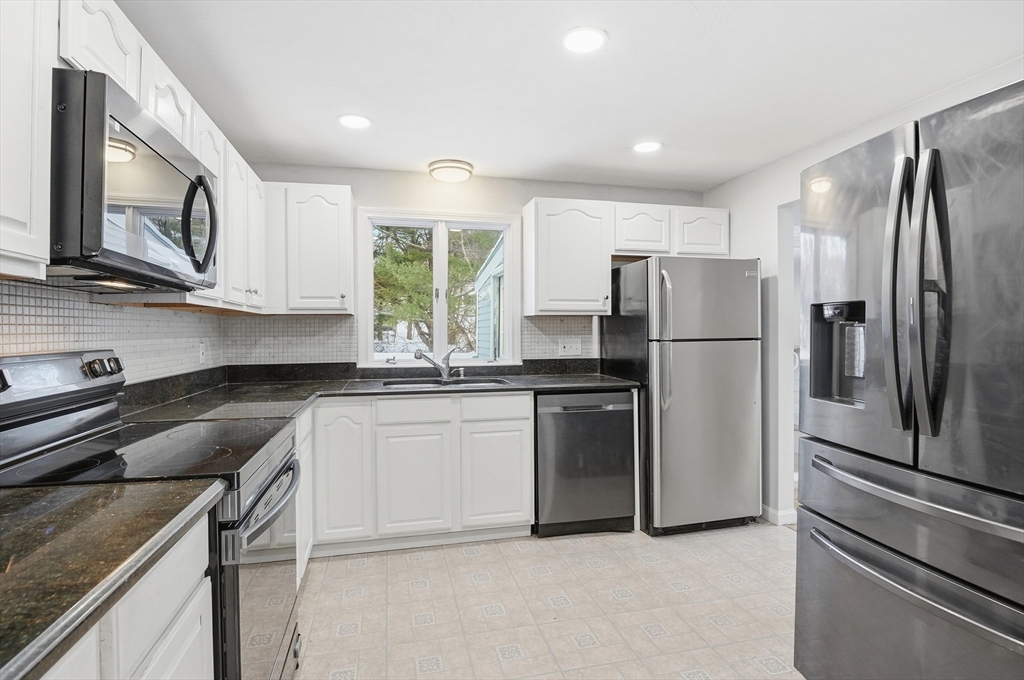 36 Hillandale Road Ashburnham, MA 01430 - Photo 7 of 31 a kitchen with a refrigerator sink and microwave