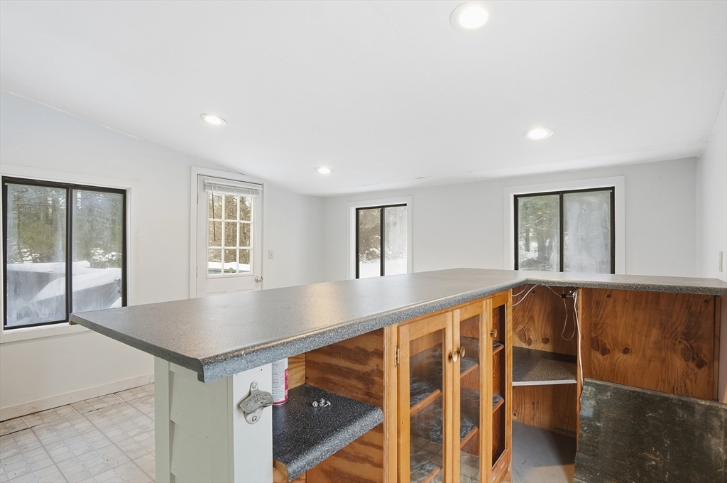 36 Hillandale Road Ashburnham, MA 01430 - Photo 10 of 31 a view of an empty room with wooden floor and windows