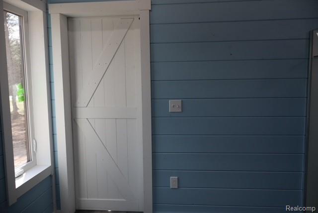 1545 South La Chance Road Lake City, MI 49651 - Photo 37 of 51 Detailed view of a barn door and wood walls