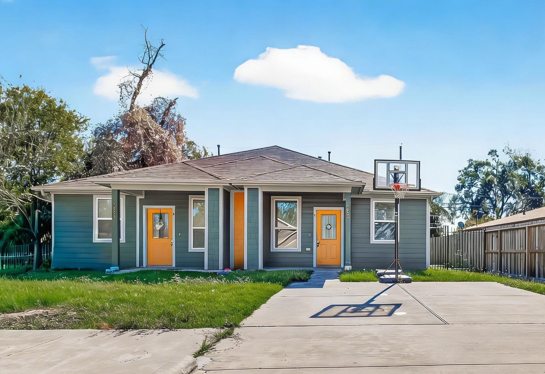 a house that has a tree in front of it