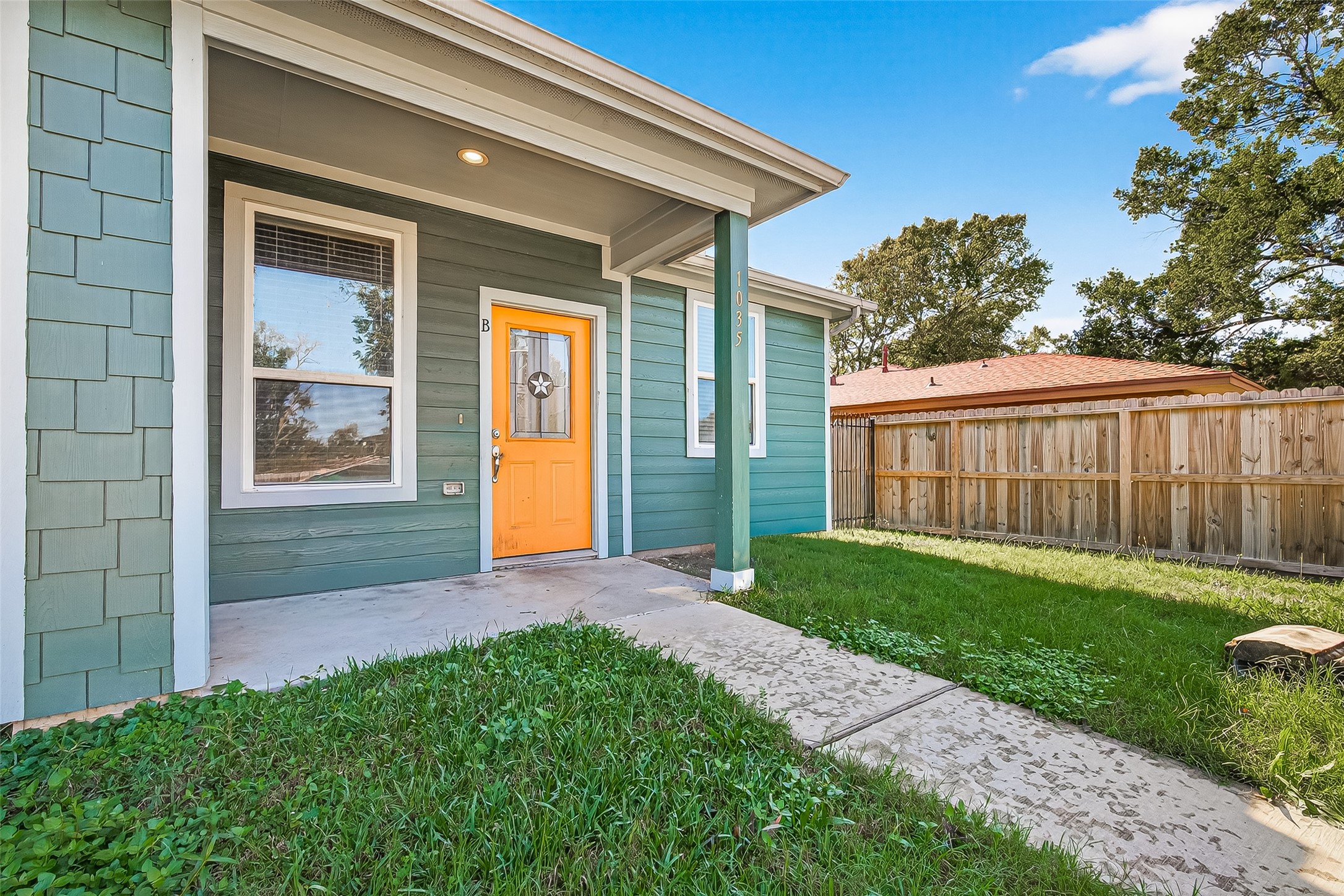 1035 Junell Street Houston, TX 77088 - Photo 2 of 14 a view of a house with a yard and pathway