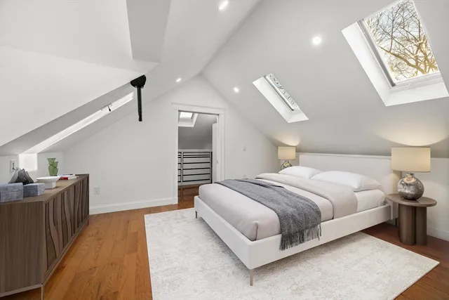 a bedroom with bed and window