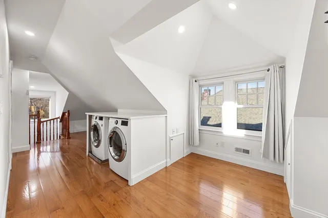 a view of a hallway with a washer and dryer