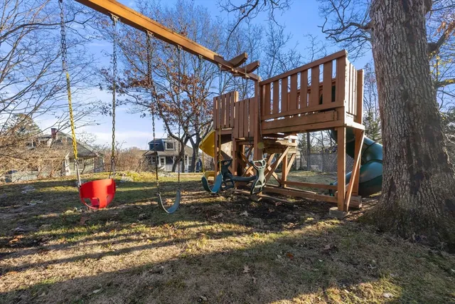 a backyard of a house with barbeque oven