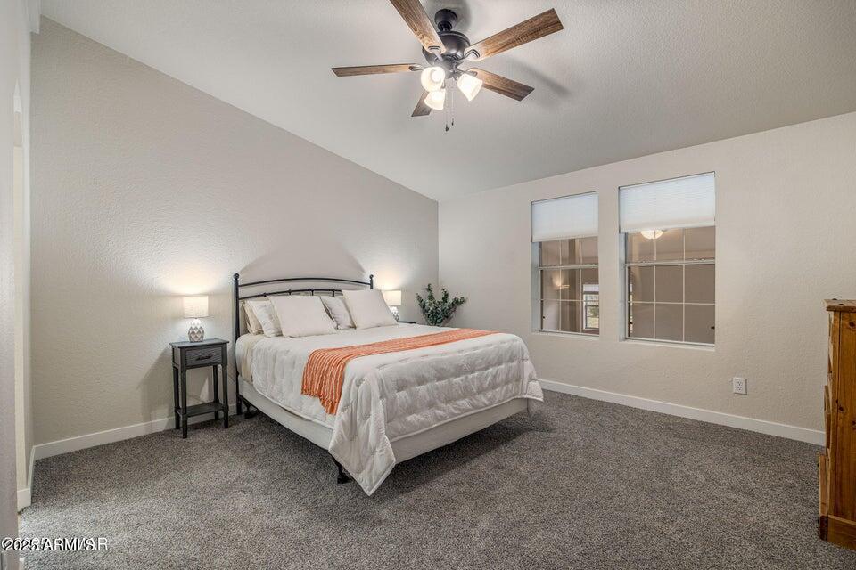 1590 Peterson Road Lakeside, AZ 85929 - Photo 12 of 41 a bedroom with a bed and window