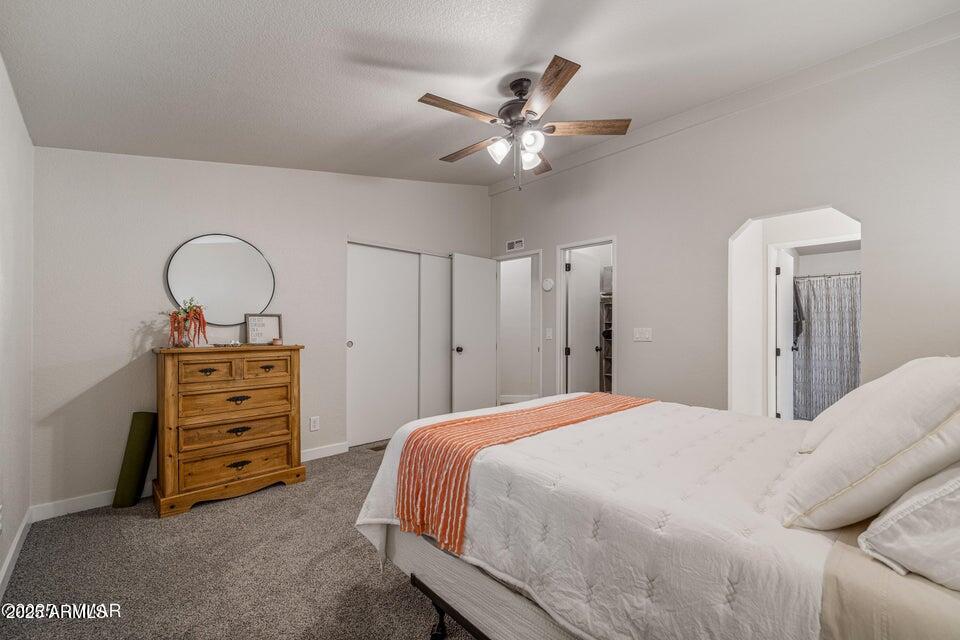 1590 Peterson Road Lakeside, AZ 85929 - Photo 13 of 41 a bedroom with a bed and a dresser