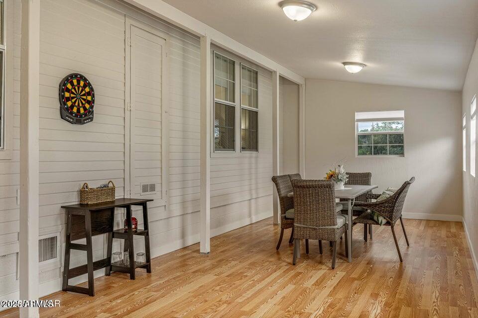 1590 Peterson Road Lakeside, AZ 85929 - Photo 18 of 41 a view of a dining room with furniture and wooden floor