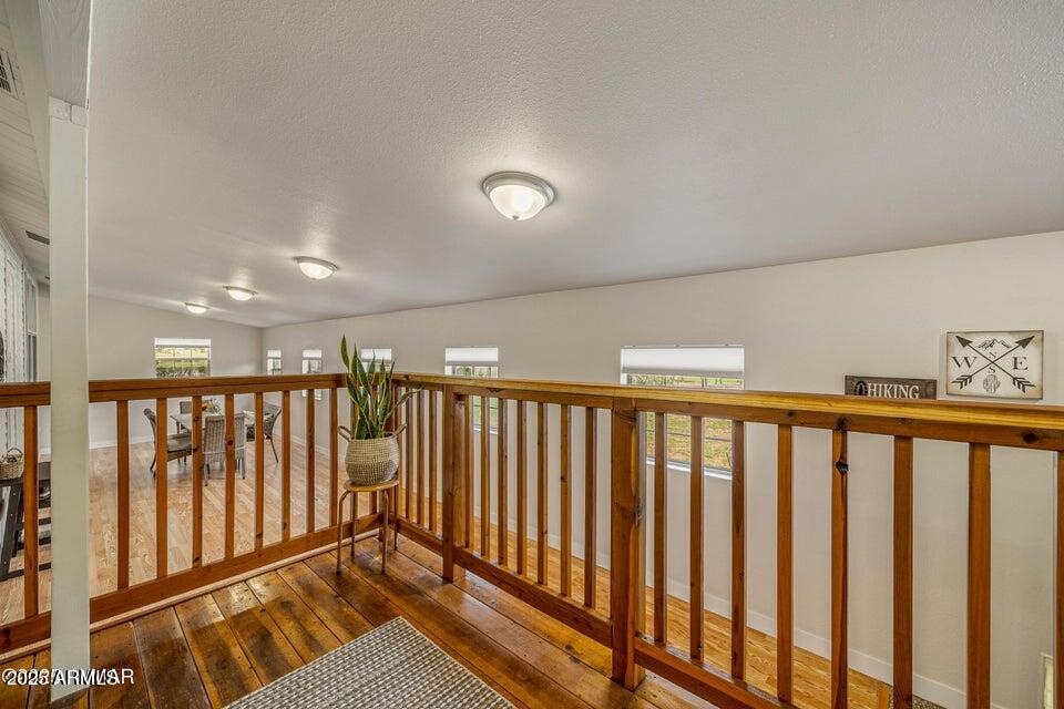 1590 Peterson Road Lakeside, AZ 85929 - Photo 19 of 41 a view of a hallway with wooden floor