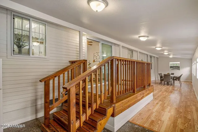 a view of entryway with wooden floor and stairs