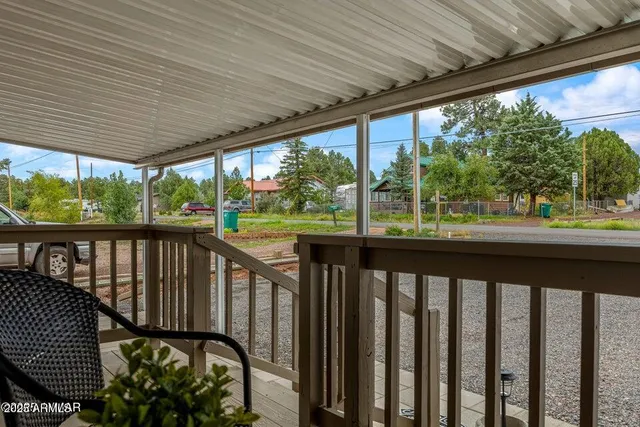 a view of a balcony with wooden floor