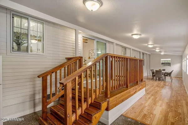 a view of entryway with wooden floor and stairs