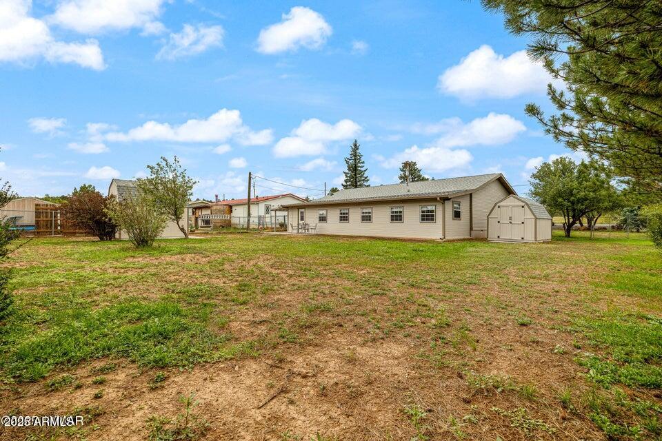 1590 Peterson Road Lakeside, AZ 85929 - Photo 32 of 41 a front view of a house with garden