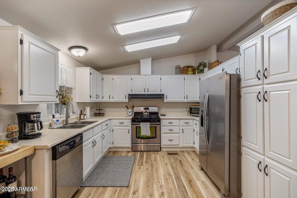1590 Peterson Road Lakeside, AZ 85929 - Photo 6 of 41 a kitchen with a refrigerator stove top oven and sink