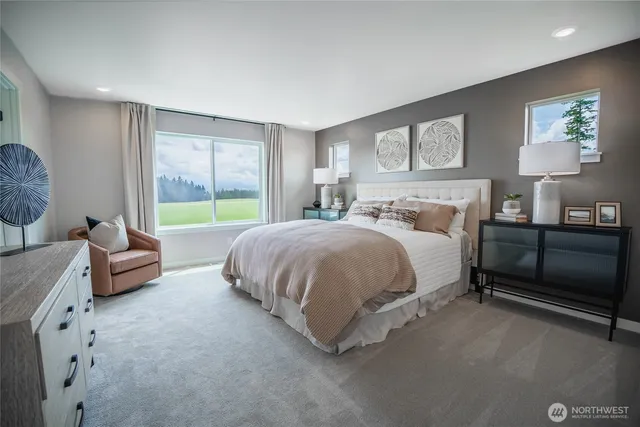 a bedroom with a bed and lamp