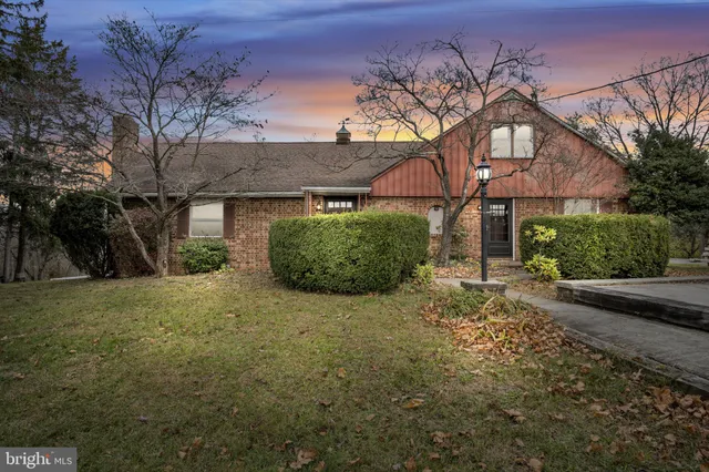 a house with a tree in front of it