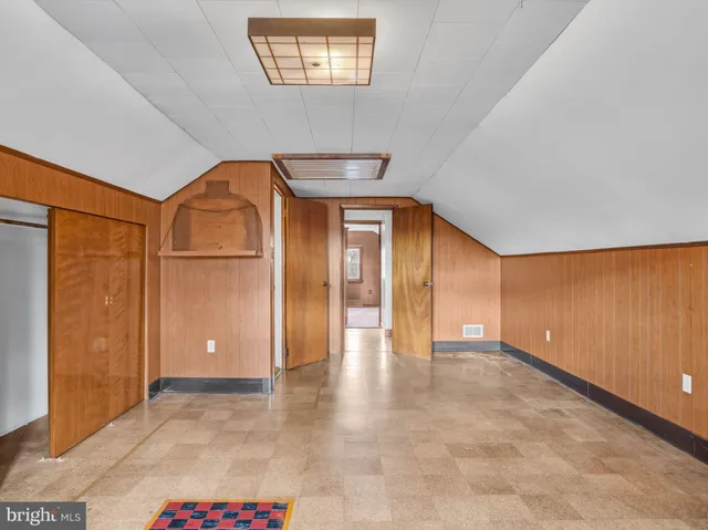 a view of a livingroom with furniture and a window