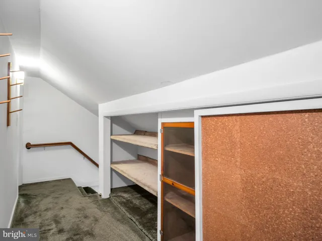 a big house with trees in front of it