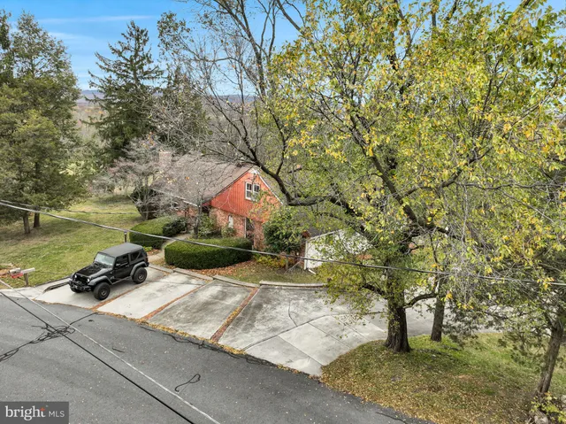 a view of residential houses with swimming pool