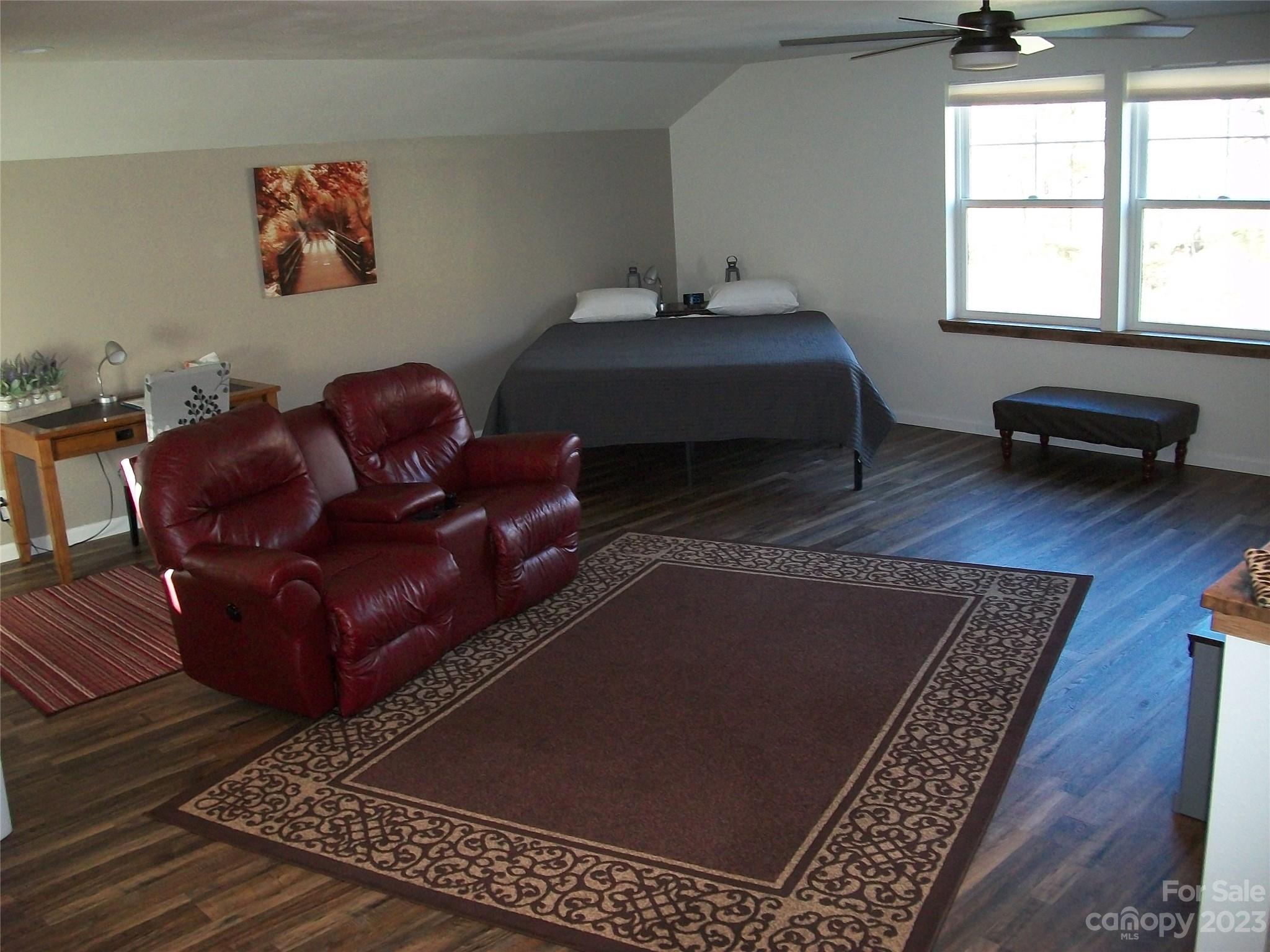 204 Mountain Spring Lane Canton, NC 28716 - Photo 16 of 18 a living room with furniture rug and window
