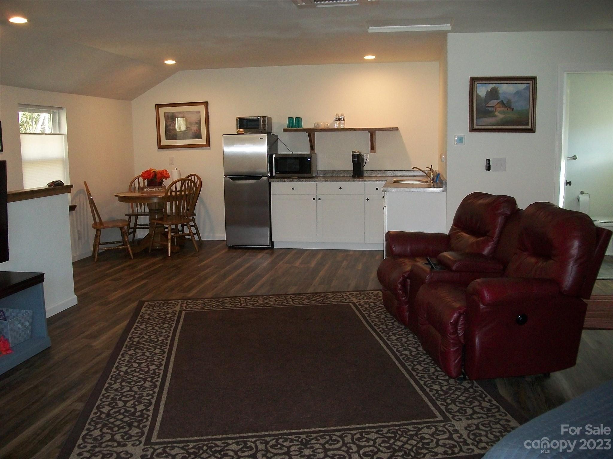 204 Mountain Spring Lane Canton, NC 28716 - Photo 17 of 18 a living room with furniture and a rug