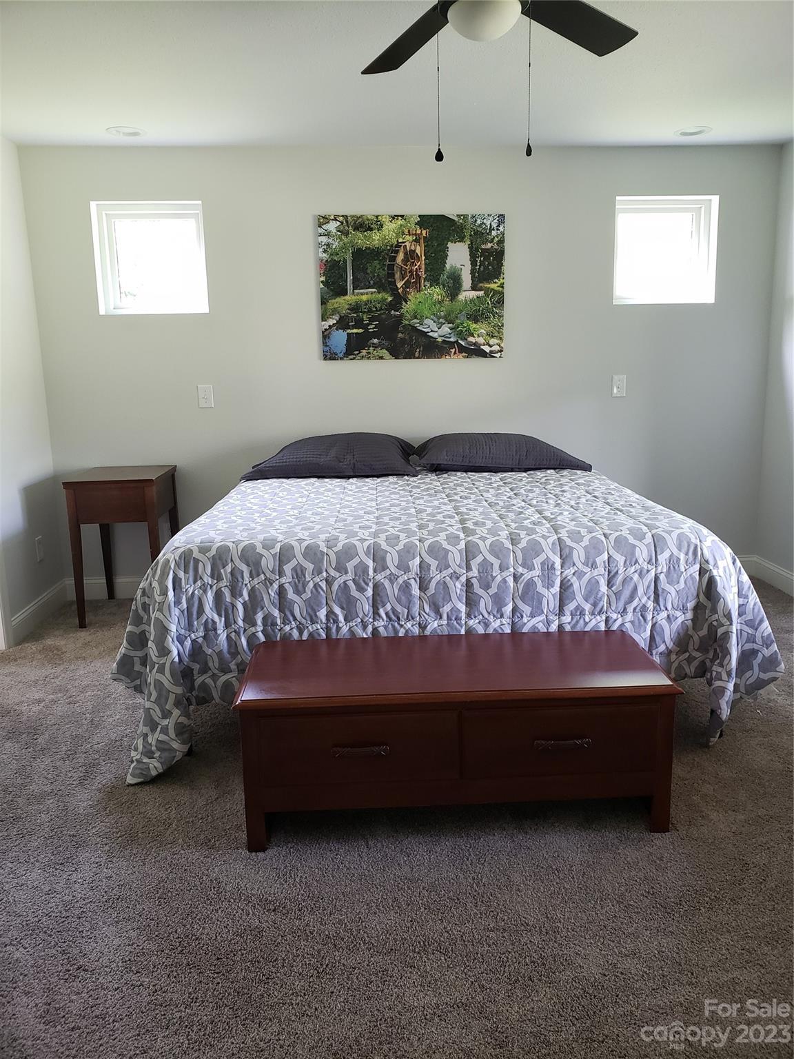 204 Mountain Spring Lane Canton, NC 28716 - Photo 7 of 18 a bed sitting in a bedroom next to a window