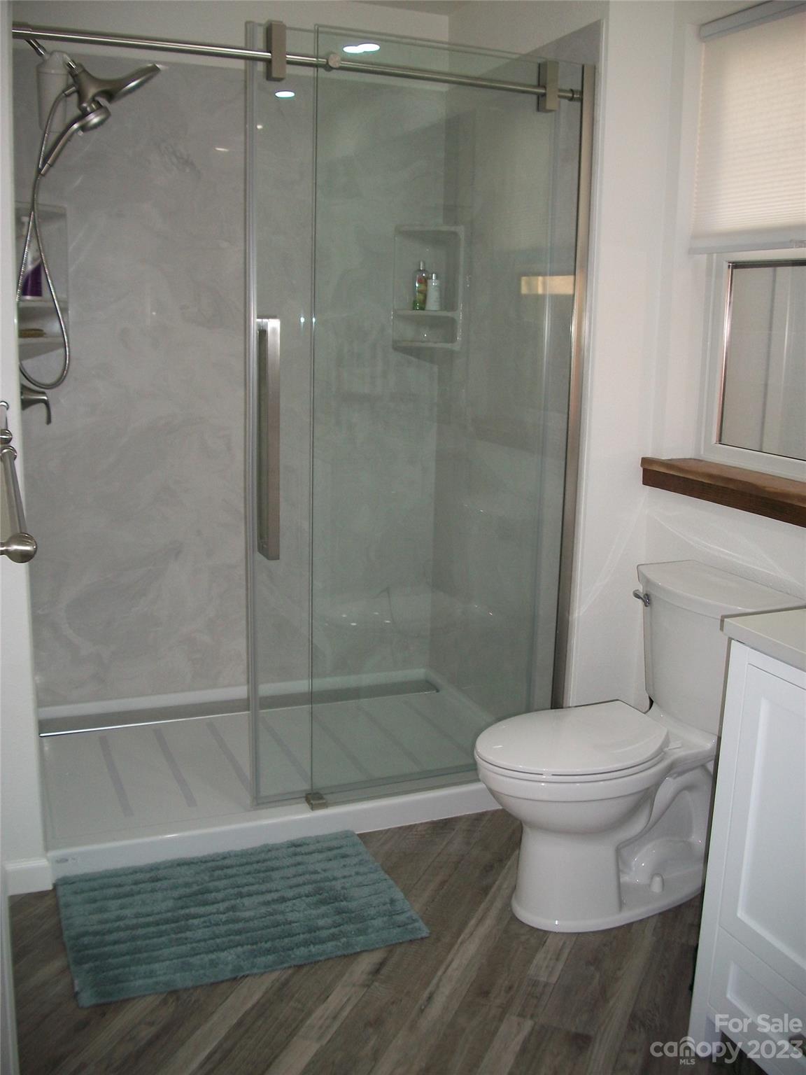 204 Mountain Spring Lane Canton, NC 28716 - Photo 9 of 18 a bathroom with a toilet and a shower